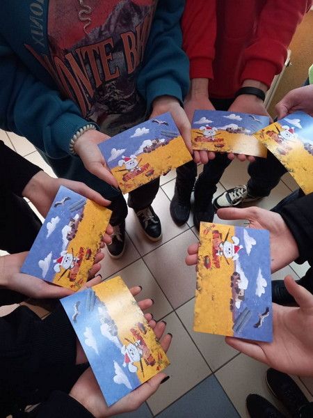 Postcards in the hands of students